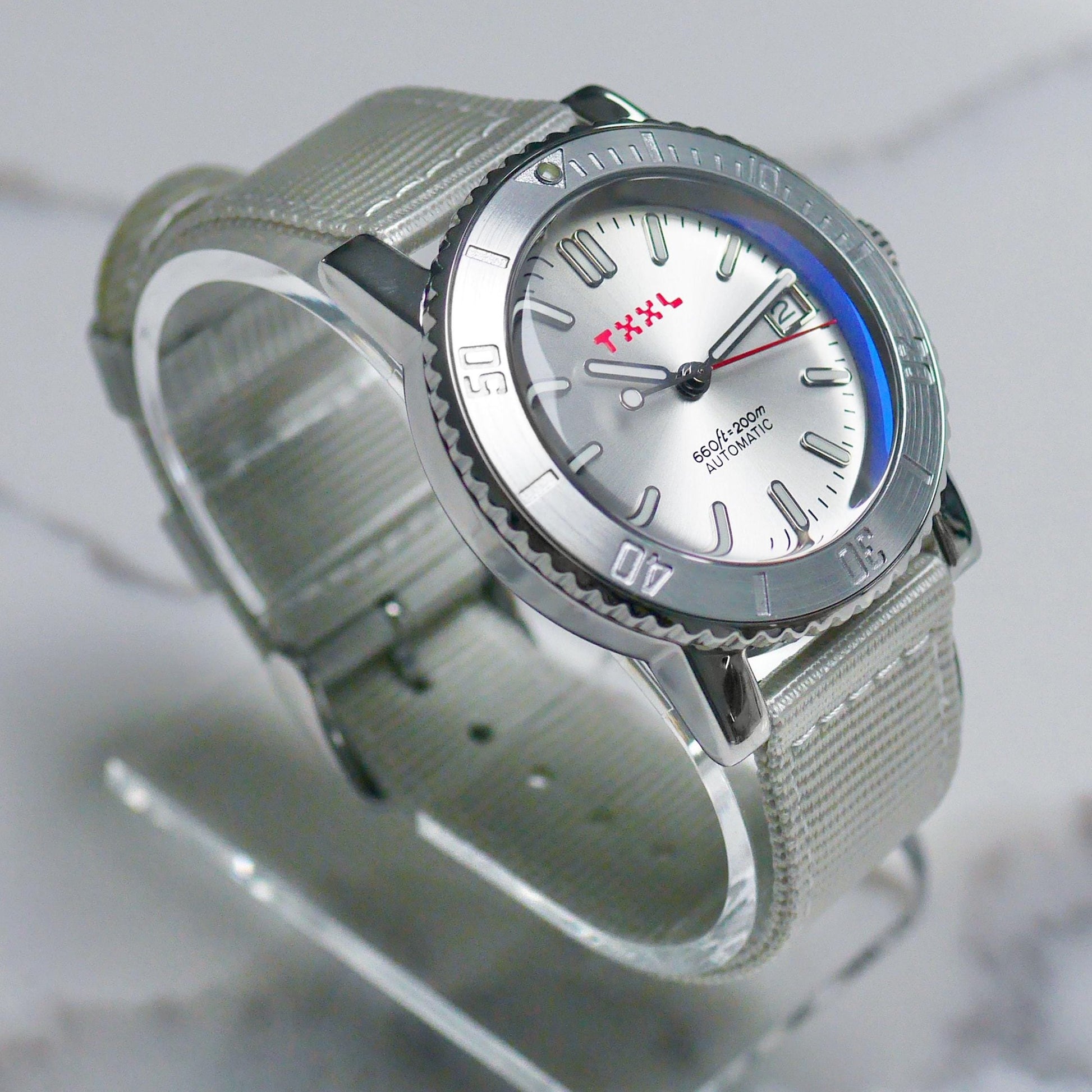 Silver stainless steel dive watch with TXXL logo