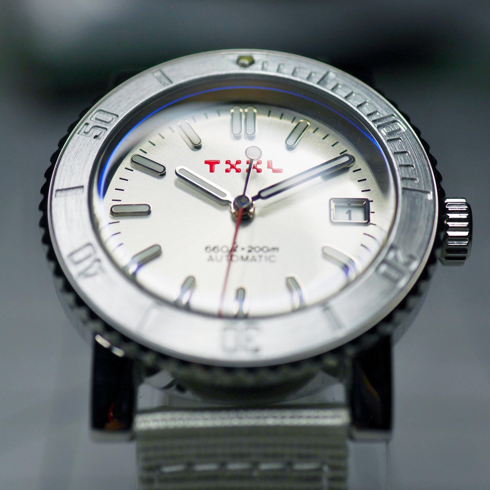 Silver stainless steel dive watch with TXXL logo