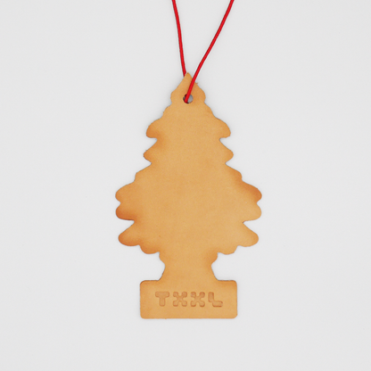 A leather little tree car freshener with a TXXL logo